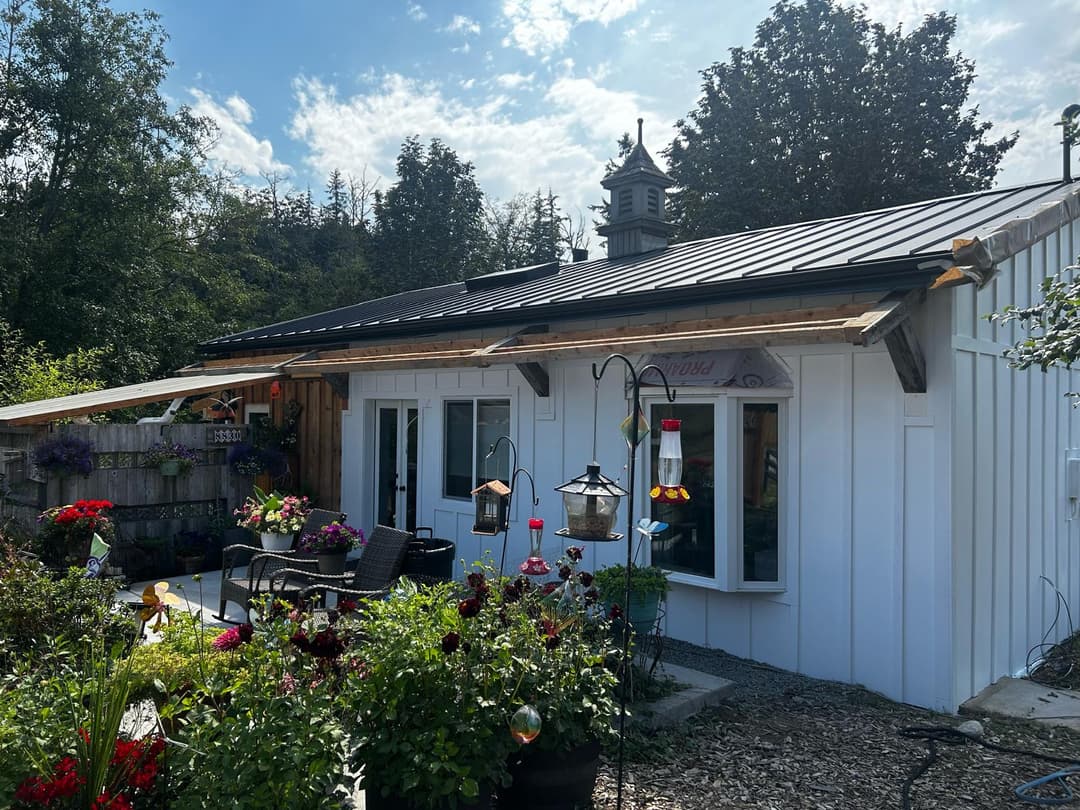 freshly painted home with white exterior siding