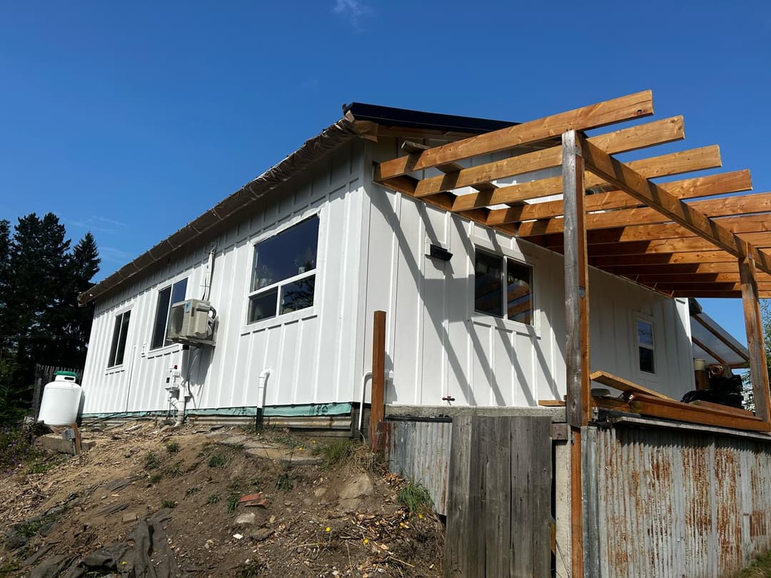 newly painted white siding on an older home